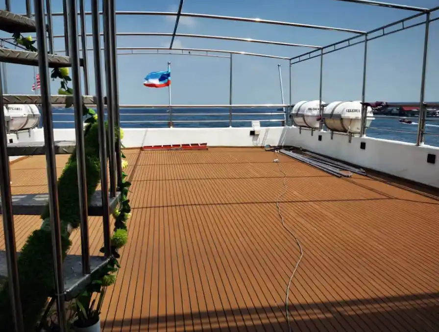 Spacious open-air sundeck on the MV Celebes Explorer 9, a perfect place to relax and enjoy the sea views during a Sipadan liveaboard trip.