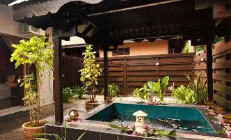 Private outdoor jacuzzi in a secluded garden courtyard, a luxurious feature of the Villas at Mataking Island Resort.