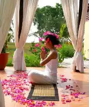 Tranquil and serene atmosphere at the Jamu Spa entrance at Mataking Island Resort, decorated with flower petals for ultimate relaxation.
