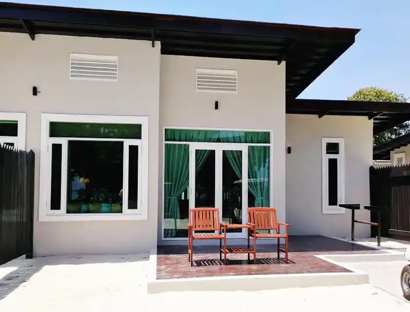 Modern exterior of a Premium Room at Mataking Island Resort, with a private patio for relaxing in the tropical surroundings.
