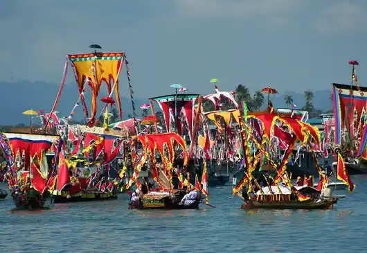This festival celebrates the local Bajau sea culture. Fleet of beautifully decorated traditional 'Lepa' boats with colourful sails and banners, celebrating the unique Bajau Laut culture during the Regatta Lepa festival in Semporna.