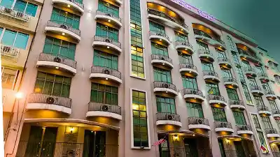 Facade of a modern hotel in Tawau City, offering comfortable accommodation for travellers on their way to Semporna and the Sipadan archipelago.