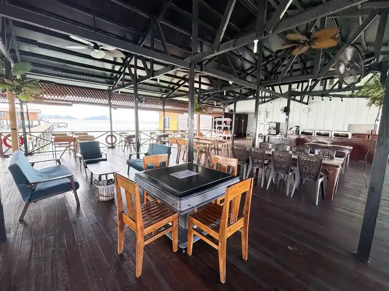 Spacious open-air restaurant and lounge at Crystal Resort Semporna, with a mahjong table ready for guests to enjoy.
