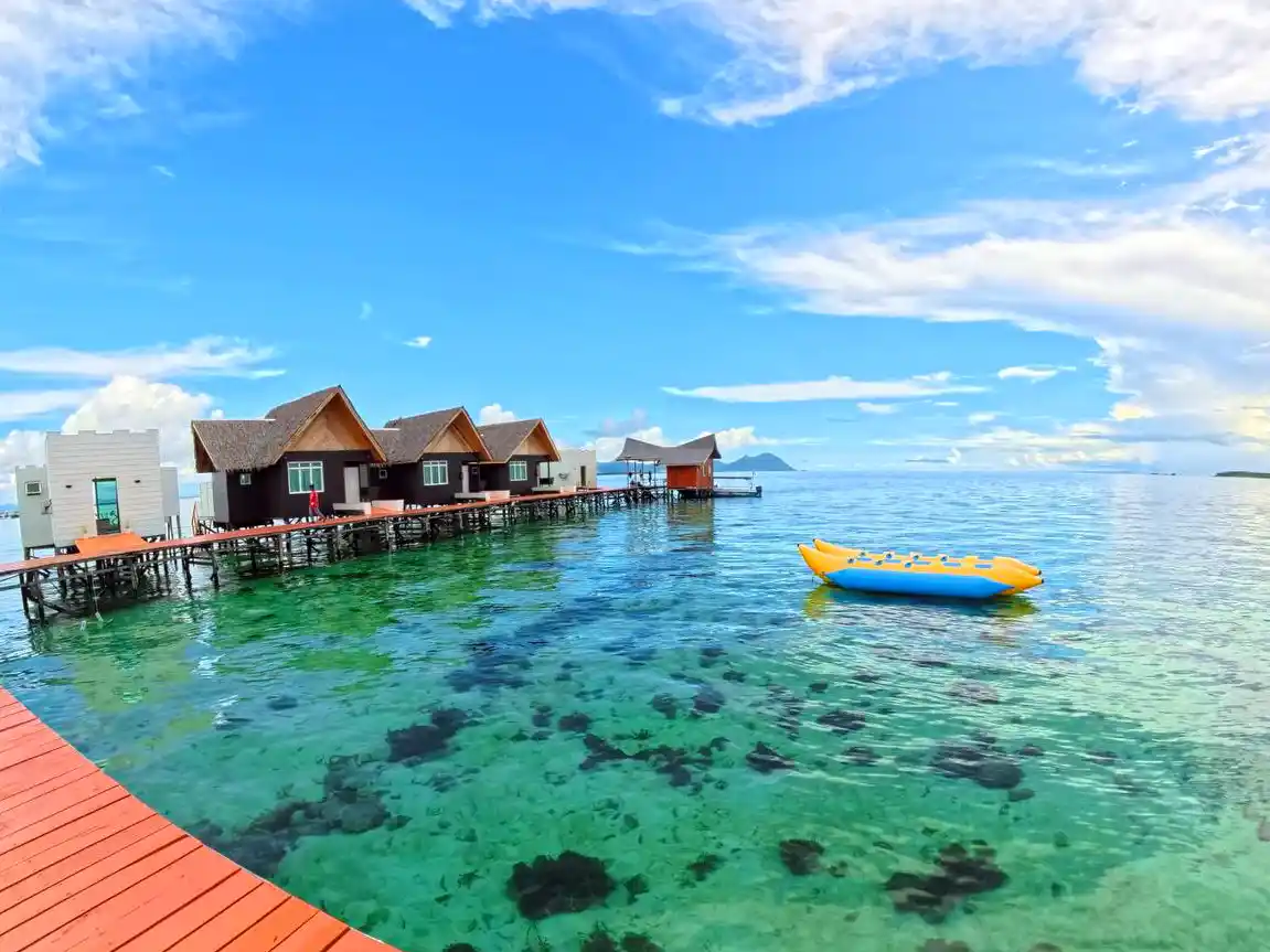 Inflatable banana boat floating in the clear turquoise water, ready for a fun ride at Danglai Resort Semporna.
