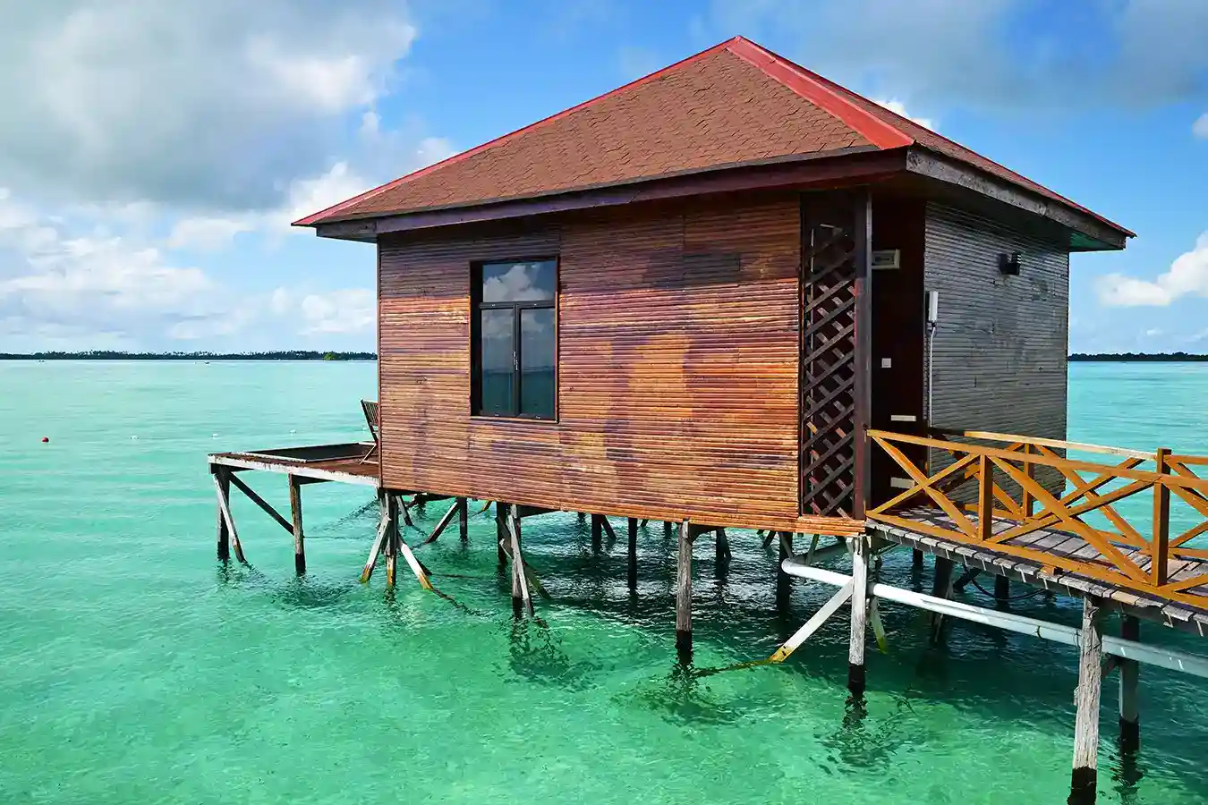 Rustic wooden sea chalet at Sky Water Villas, an elegant overwater resort perfect for a romantic getaway near Semporna.
