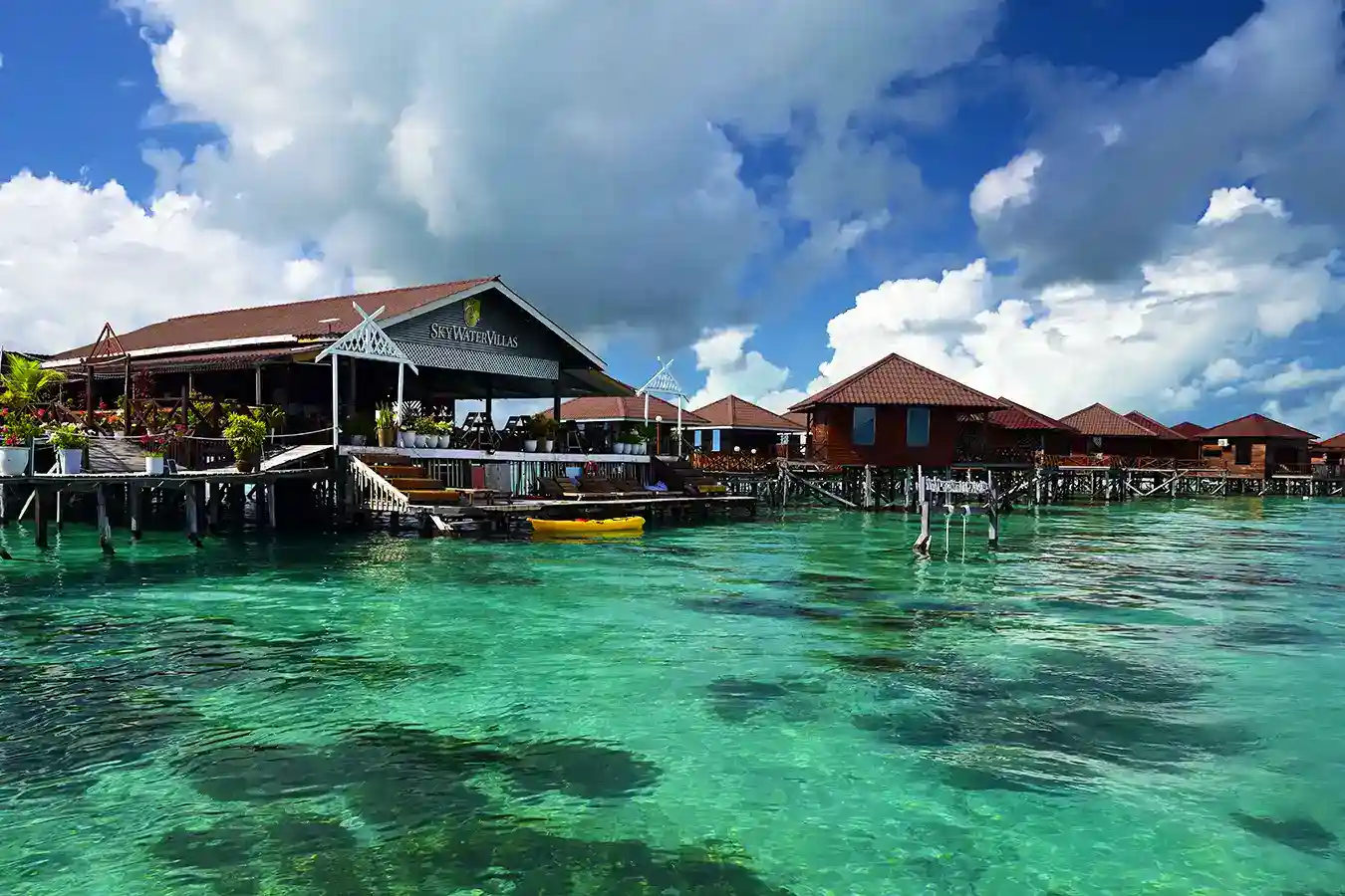 The main reception building of Sky Water Villas, an elegant overwater resort near Semporna with clear turquoise water perfect for kayaking.